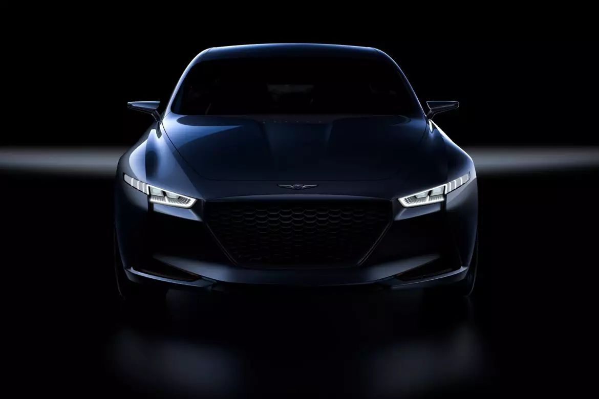 Genesis sedan lit in a dark studio