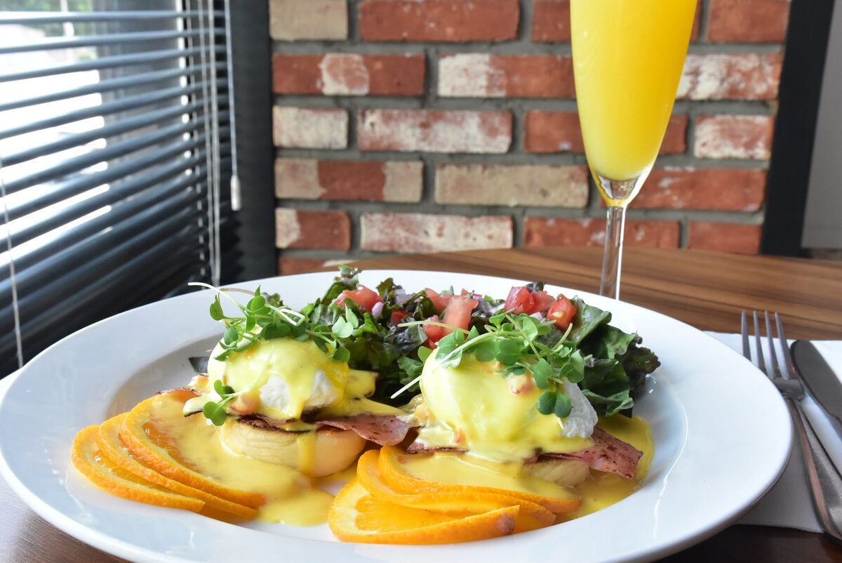 Eggs Benedict brunch with a mimosa at WinK